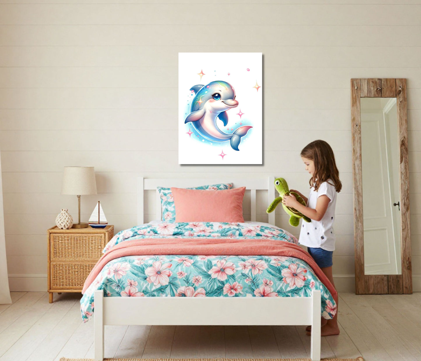 A child's bedroom scene with a white bed dressed in floral bedding and a coral throw, a girl standing beside it, and a framed dolphin artwork hanging on the wall above the bed.