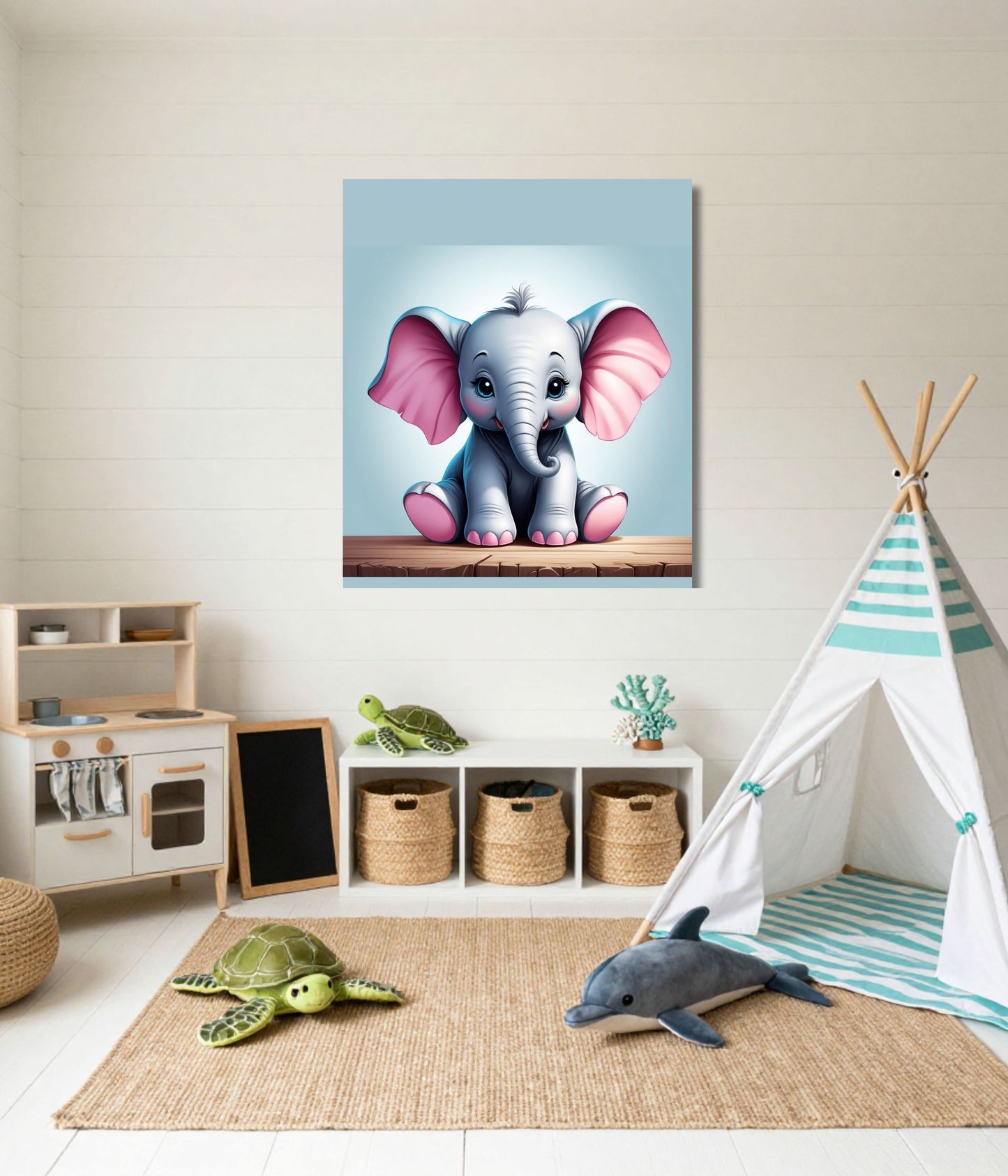 A vertical canvas wall art print featuring a cute cartoon baby elephant with pink ears, displayed in a styled children's room with a play tee, rug, and toys.
