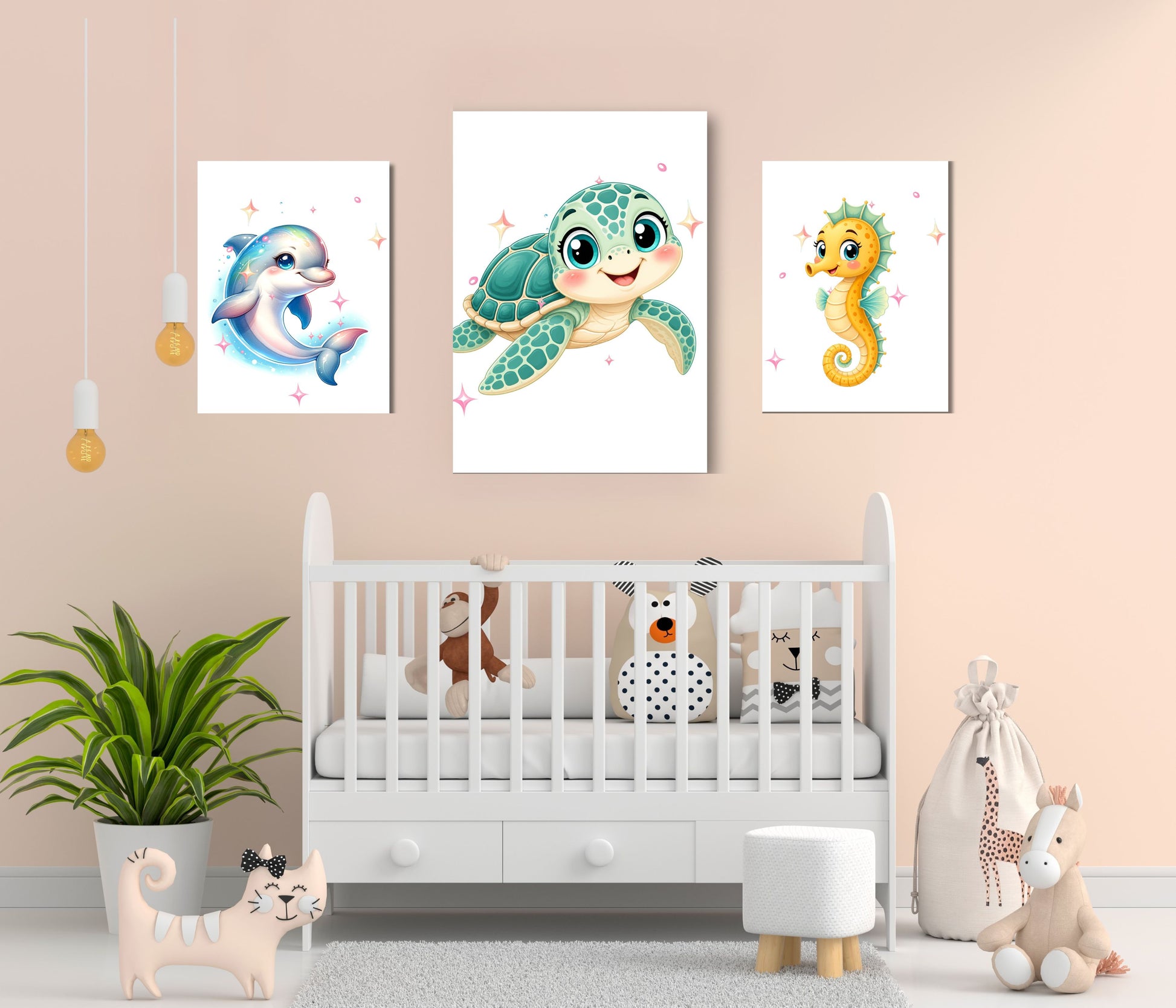 Three vertical canvas prints featuring cartoon sea life illustrations—a blue dolphin, a green sea turtle, and a yellow seahorse—displayed on a peach wall above a white baby crib in a styled nursery setting.