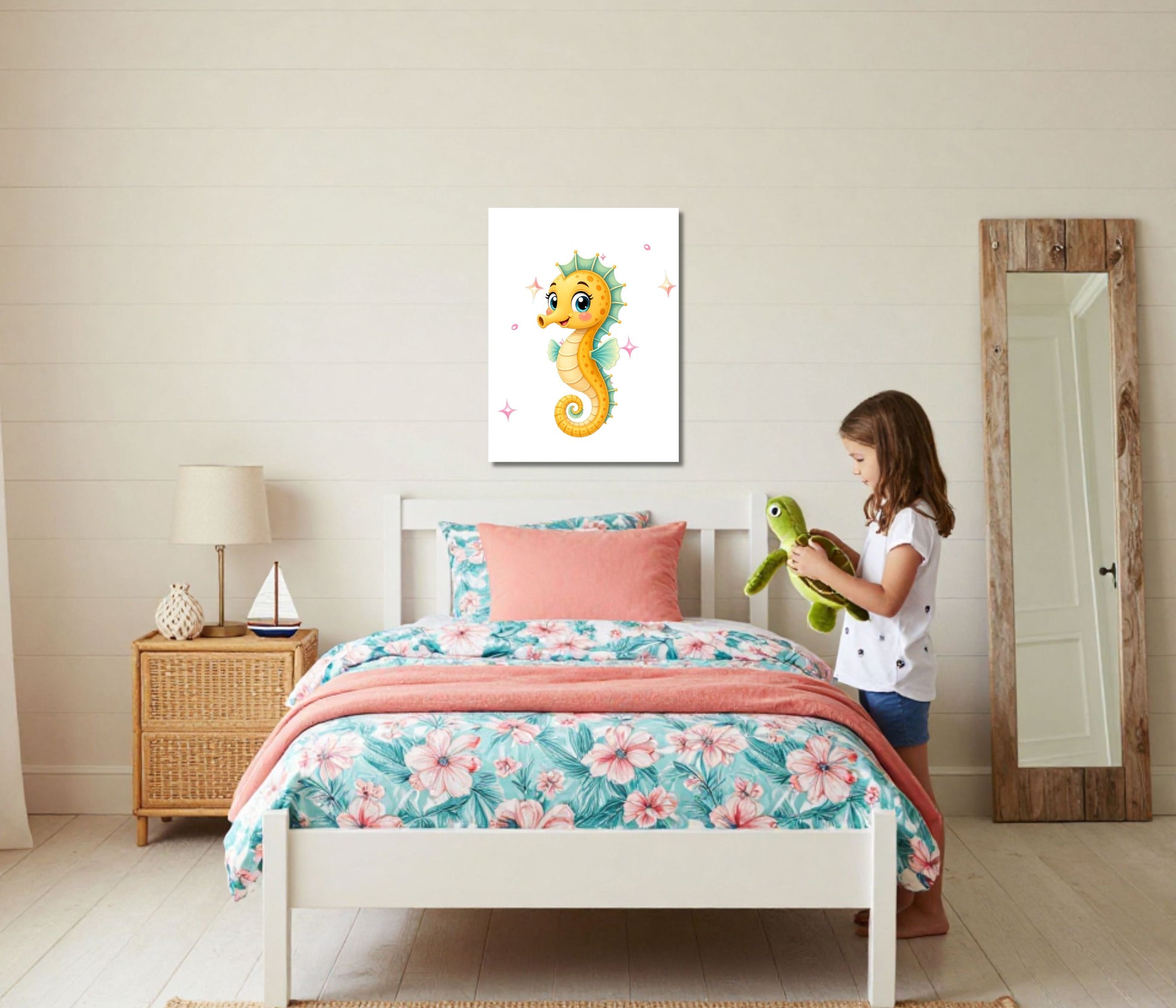 A child's bedroom scene with a girl standing beside a bed holding a green plush toy. The wall above the bed features a framed print of a yellow seahorse on a white background.