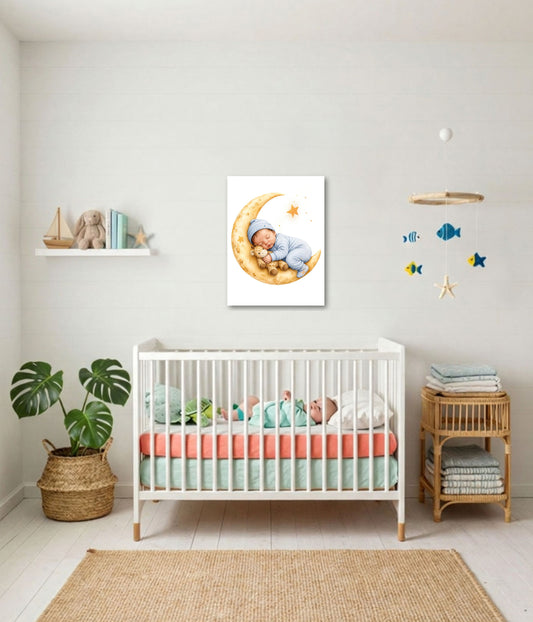 A framed wall art print showing a baby sleeping on a crescent moon with stars, displayed above a white crib in a styled nursery room with a plant, shelf, and mobile.